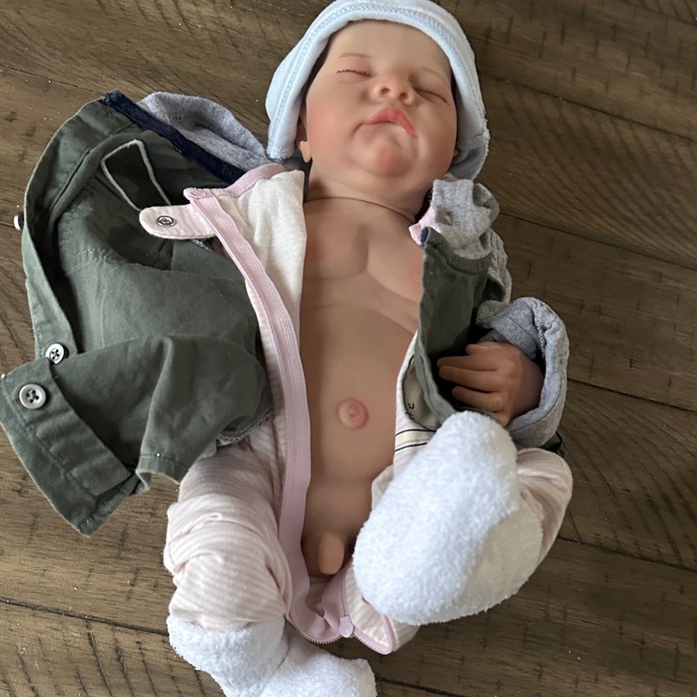 Cozy Baby Doll with Green Jacket and White Booties